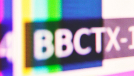 Close-up photo of a screen with broadcast colour bars on it and 'BBCTX-1' written over it.