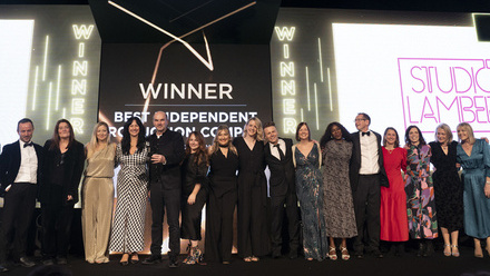 Photo of the Studio Lambert team on stage at the Broadcast Awards. A large screen behind them says 'Winner'.