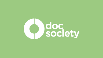 Doc Society logo in white on a lime green background.