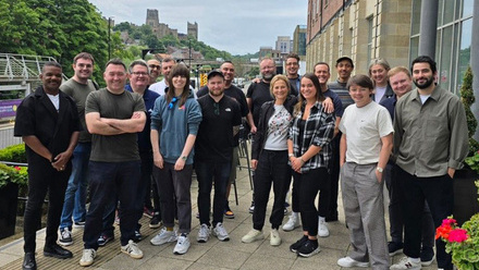 Photo of the Pact Future North East cohort stood outside as a group during a workshop day.