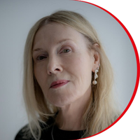 Headshot: Jane Muirhead, a woman with long fair hair wearing a dark top.