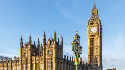 Photo of the Houses of Parliament, with St Stephen's Tower (Big Ben) prominent and a blue sky above.