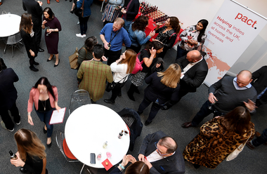 Overhead shot of people networking at the launch of the Pact office in Leeds (2019)