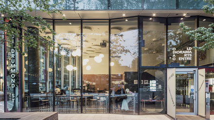 Photo of the entrance to the Old Diorama Arts Centre, a modern, glass fronted building in an urban environment.