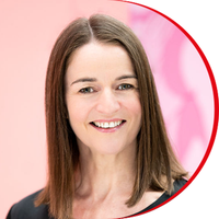 Headshot: Christine Healey - a woman with shoulder-length straight brown hair wearing a black top.